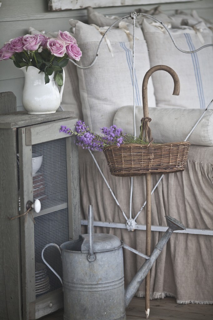 flowers and daybed on back porch