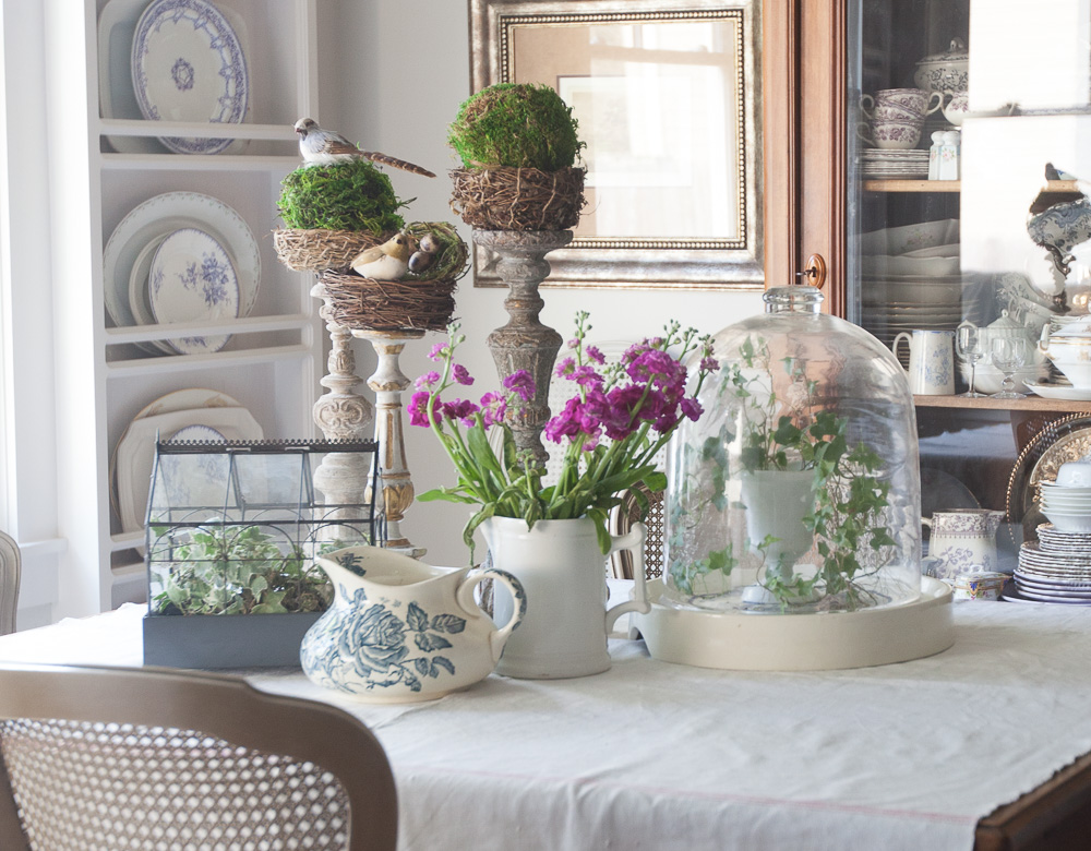 decorate for spring with moss balls on candlesticks