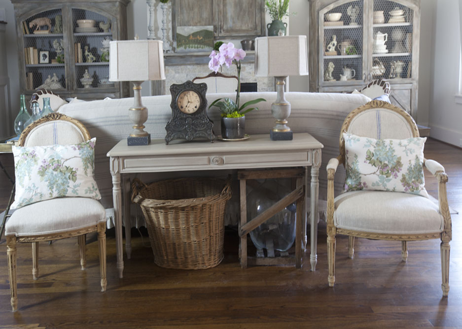 table and chairs behind couch