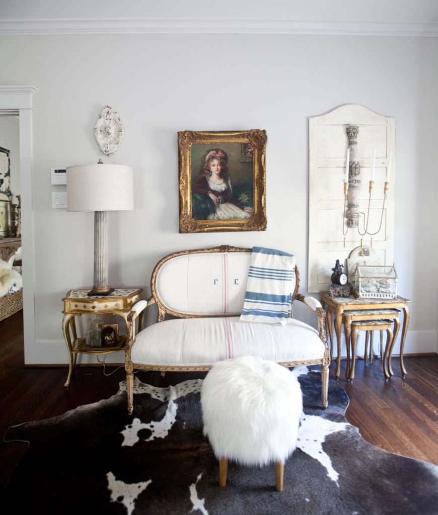 Slipcovered ottoman in white before