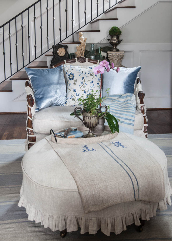 Blue ruffled slipcover and pillows