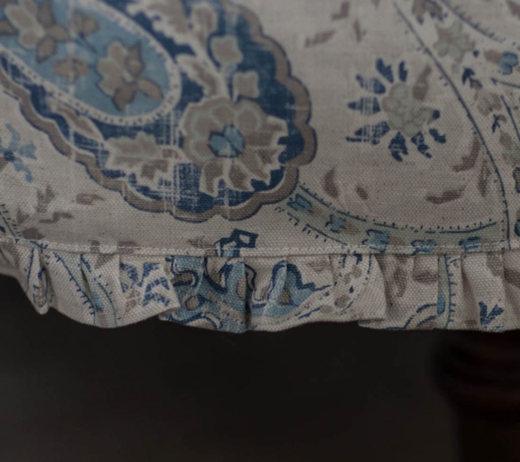 Blue ruffled slipcover detail