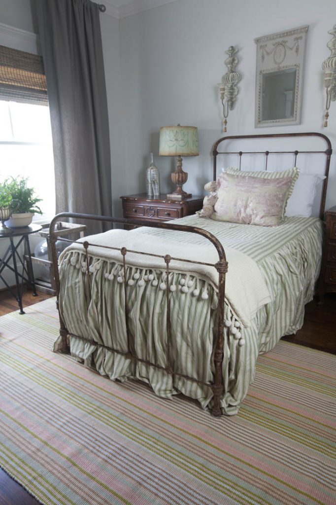 striped rug and striped green bed 